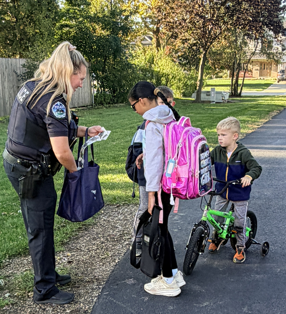 photo of students and Office Nowak walking and rolling to school