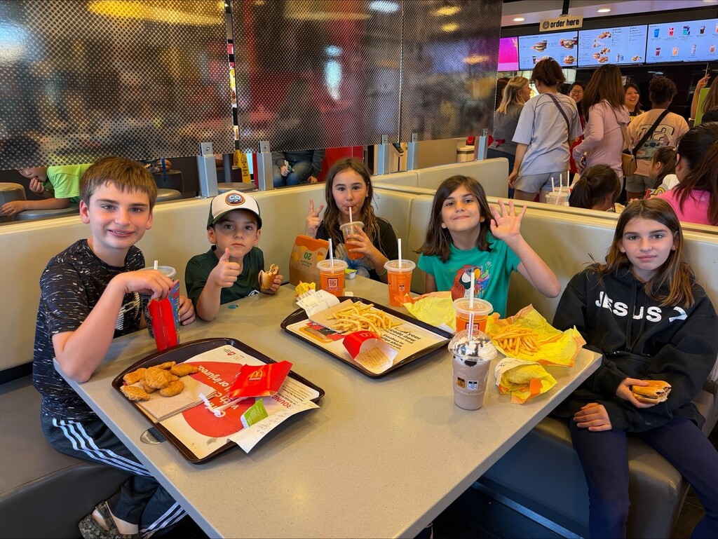 four students enjoying their McDonald's meal