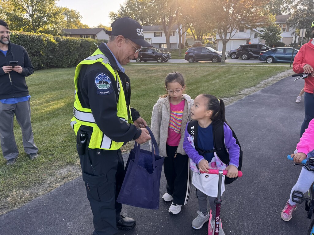 The officer with students 