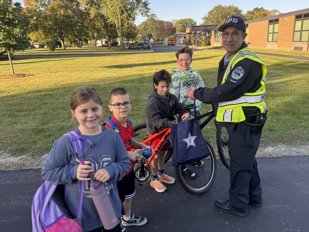 The officer with students 