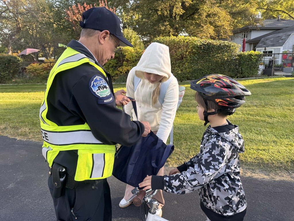 The officer with students 