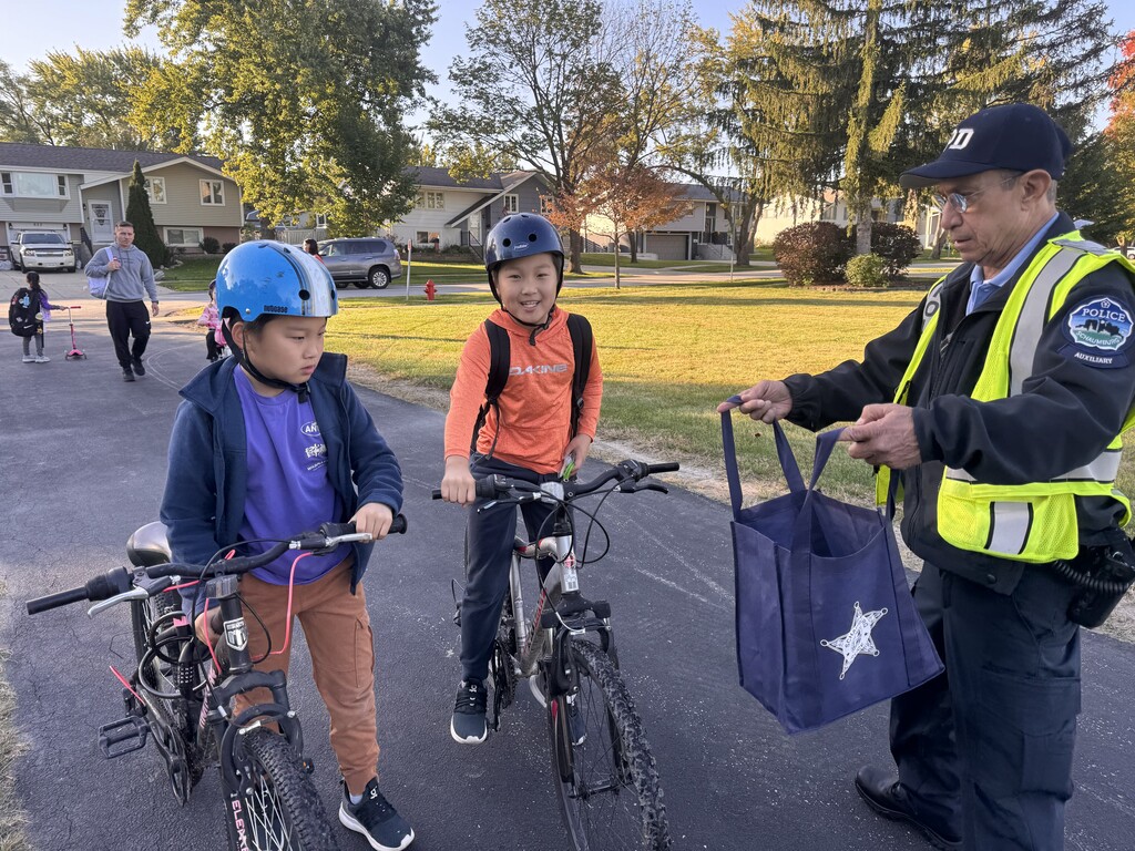 The officer with students 