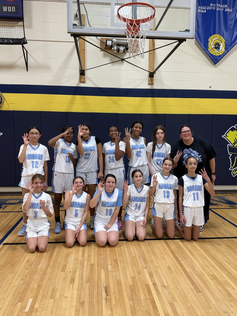 basketball team celebrating their placement