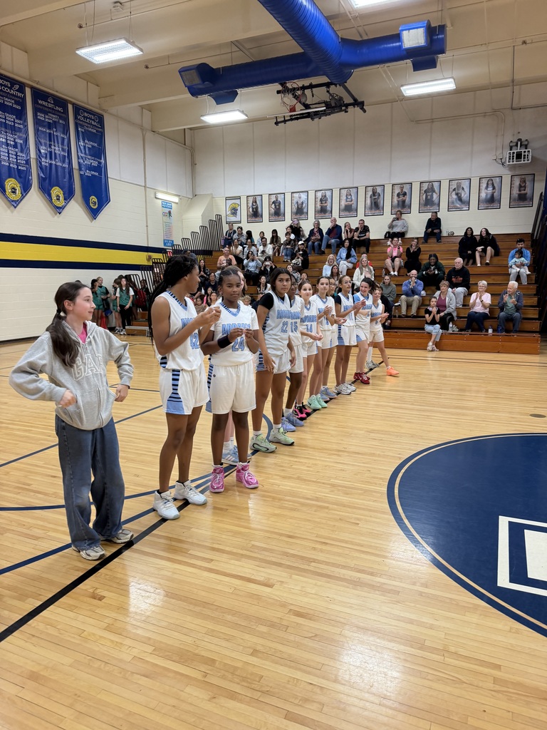 basketball team celebrating their placement