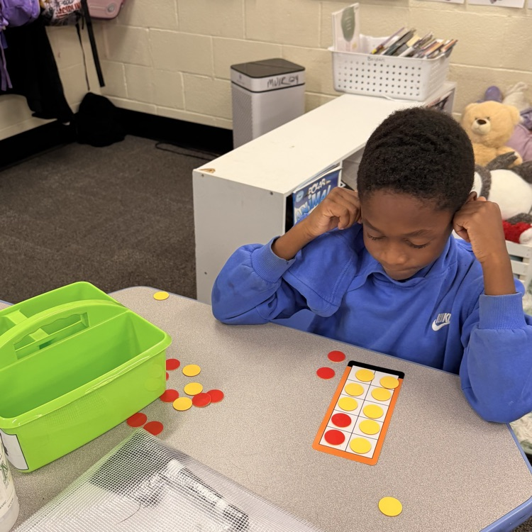 student using counters and a ten frame