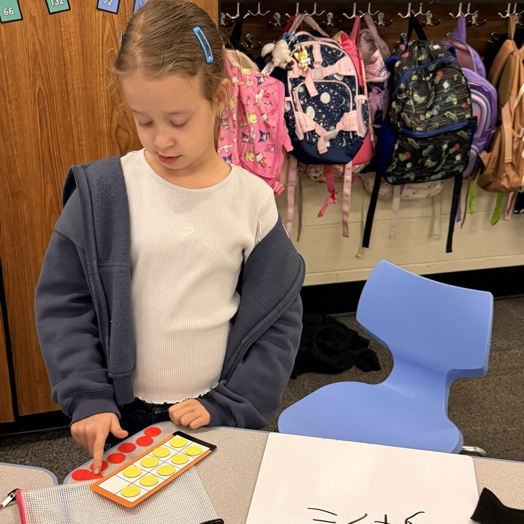 student using counters and a ten frame