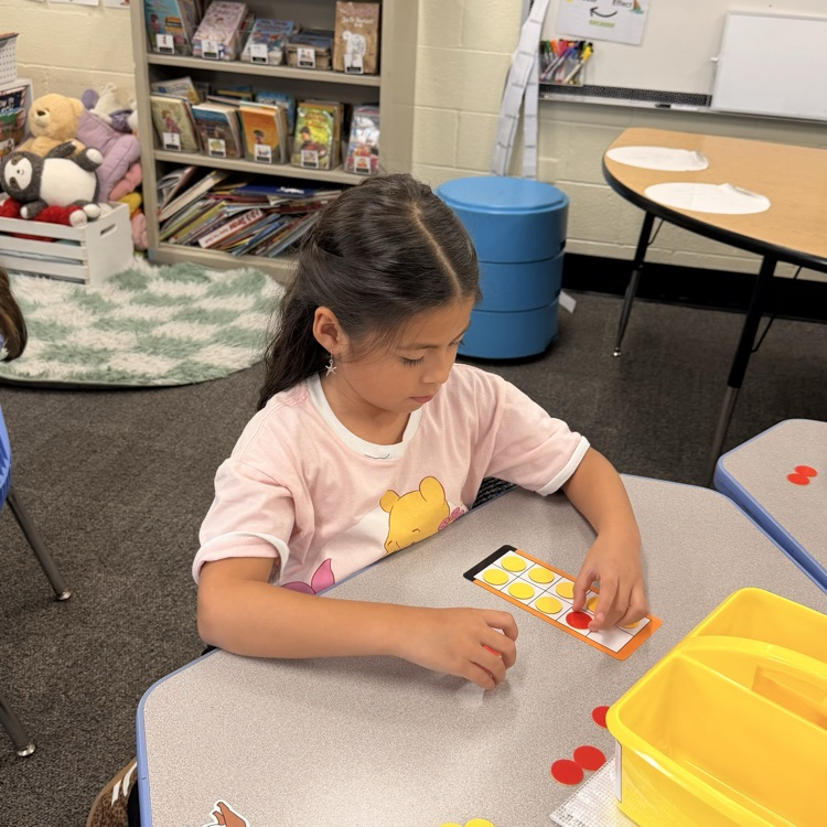 student using counters and a ten frame