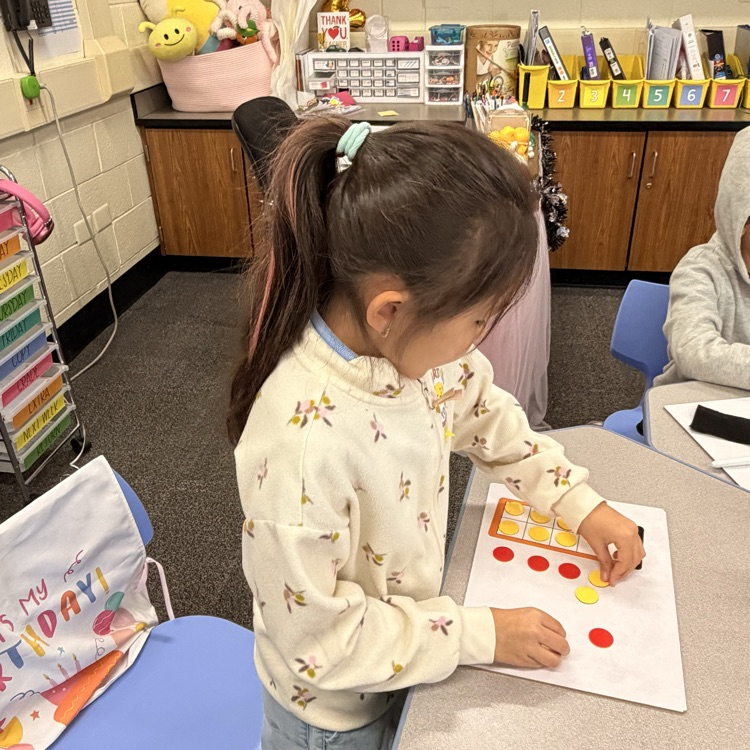 student using counters and a ten frame