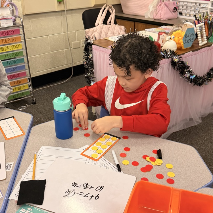 student using counters and a ten frame