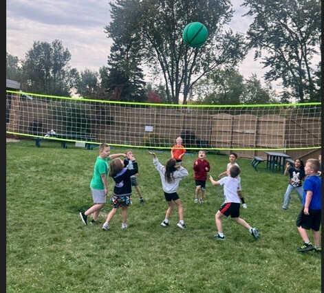 students playing volleyball