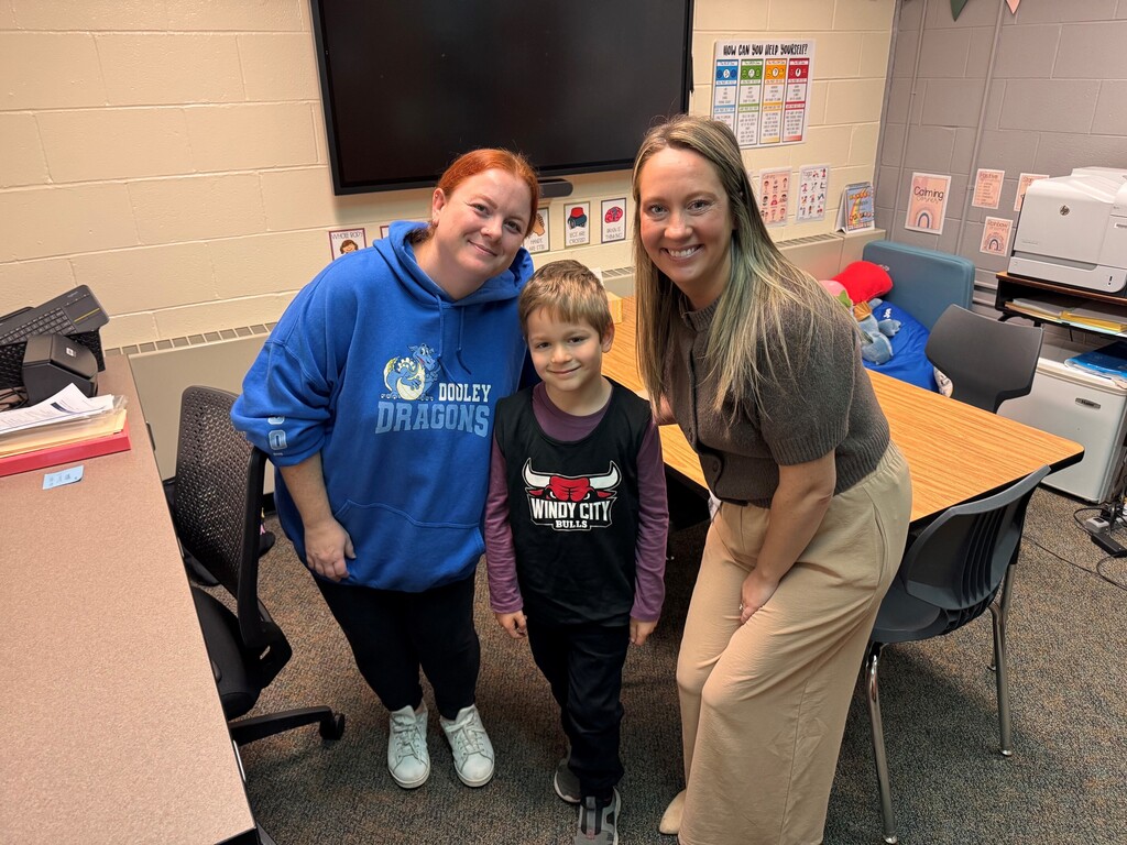 Ms. Dooley, Nicholas, and Mrs. Chua smiling