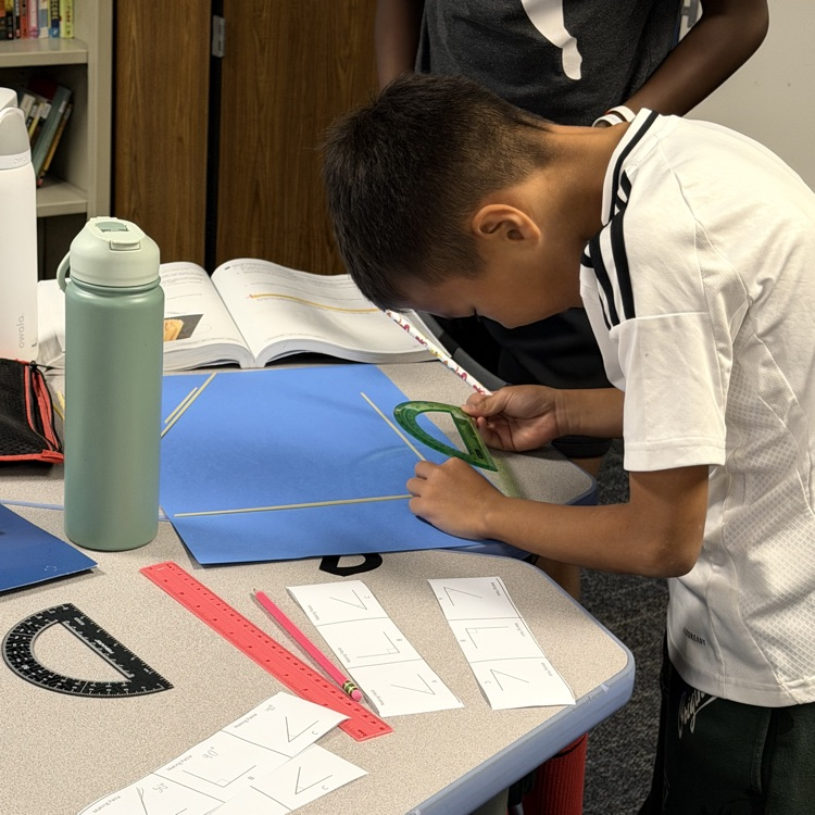 6th Grader using noodles to make triangle. 