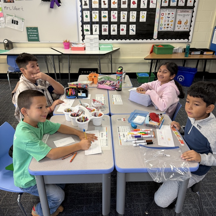 Group working at desk. 