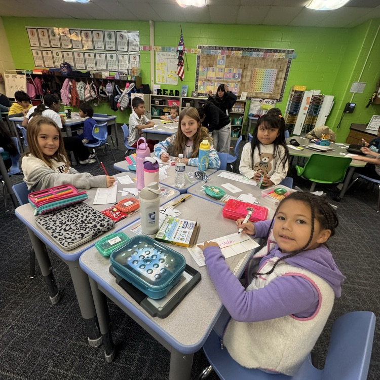 Group of students different ages working together.