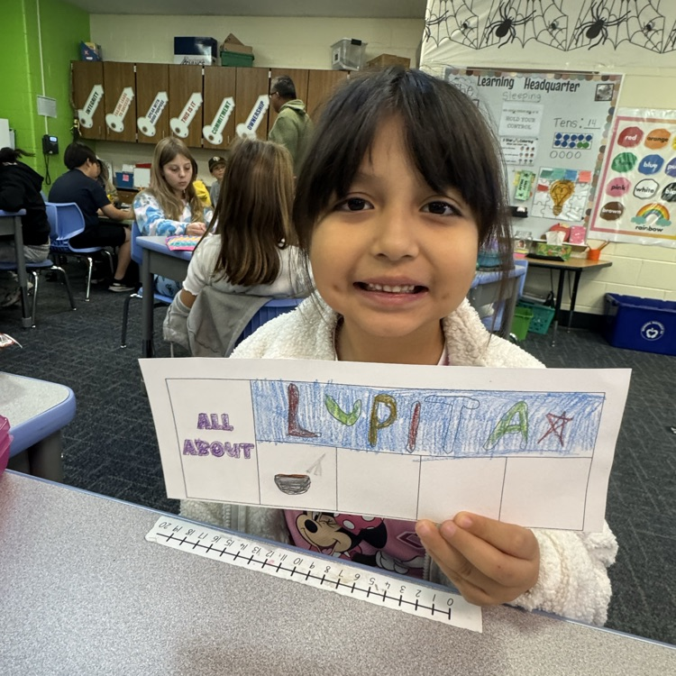 Student making name tag. 
