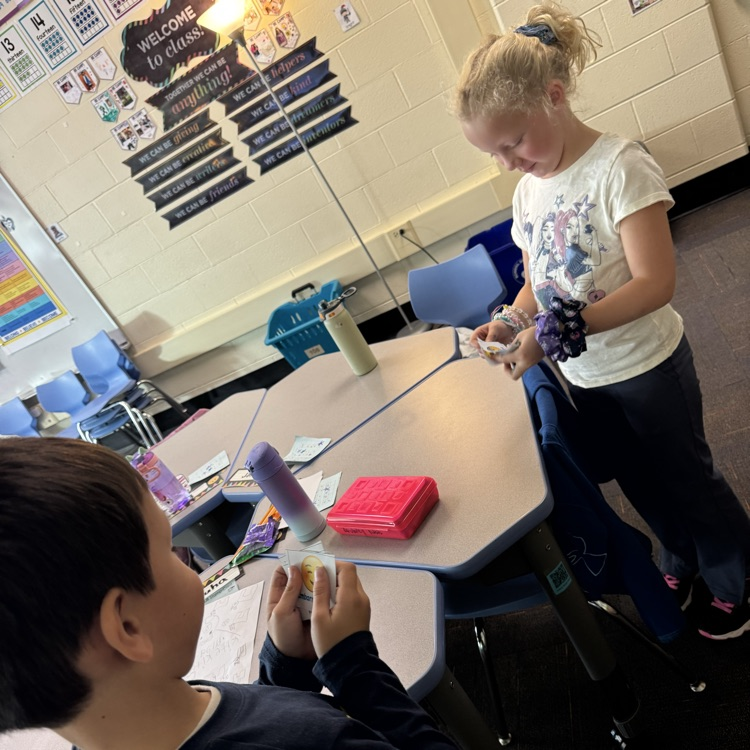 two students doing an activity with emotions
