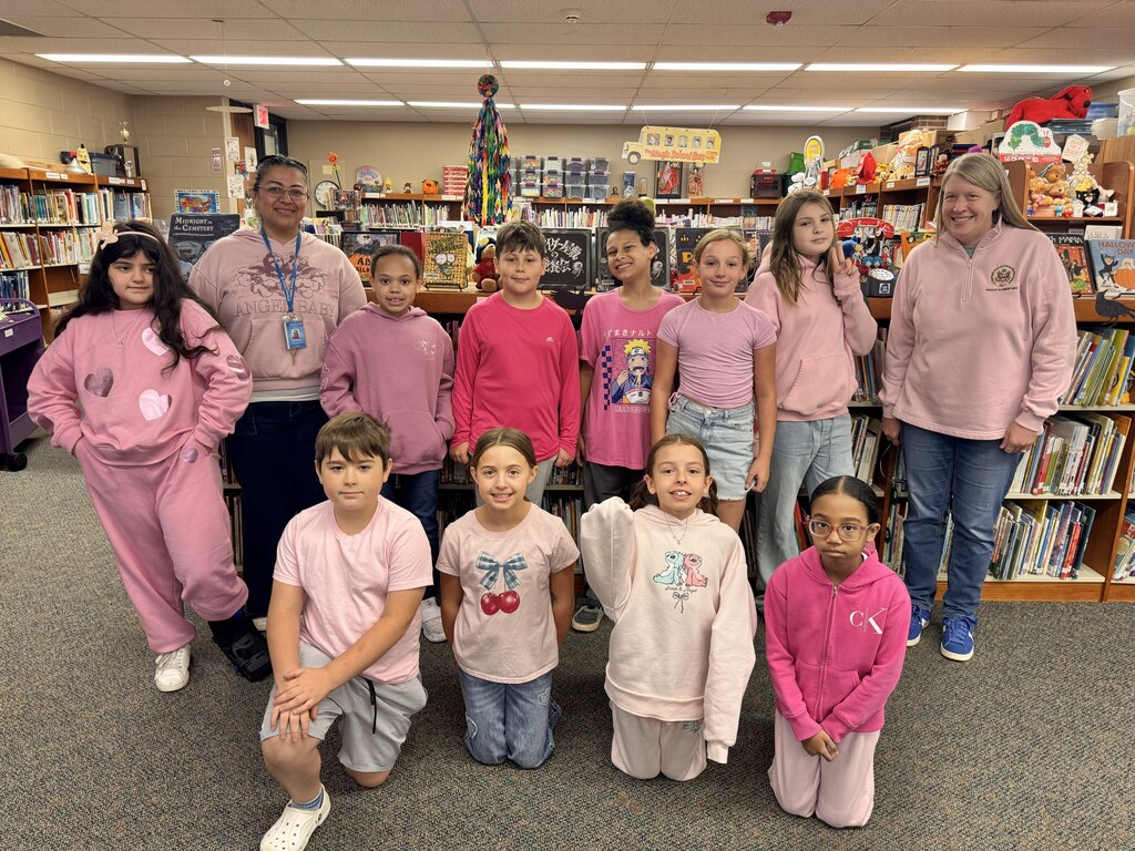 Kids wearing pink with staff