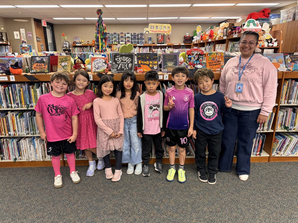 Kids wearing pink with staff member