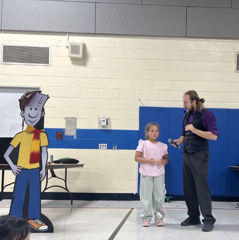 a girl talking on a microphone 