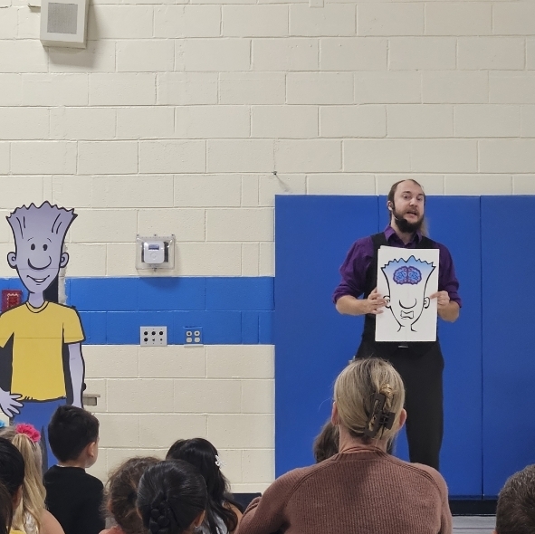 man holding a picture of a brain