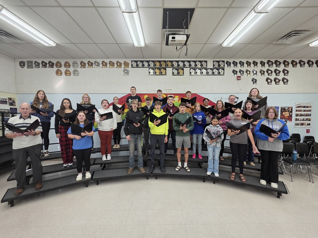 Choir members show off their new folders!