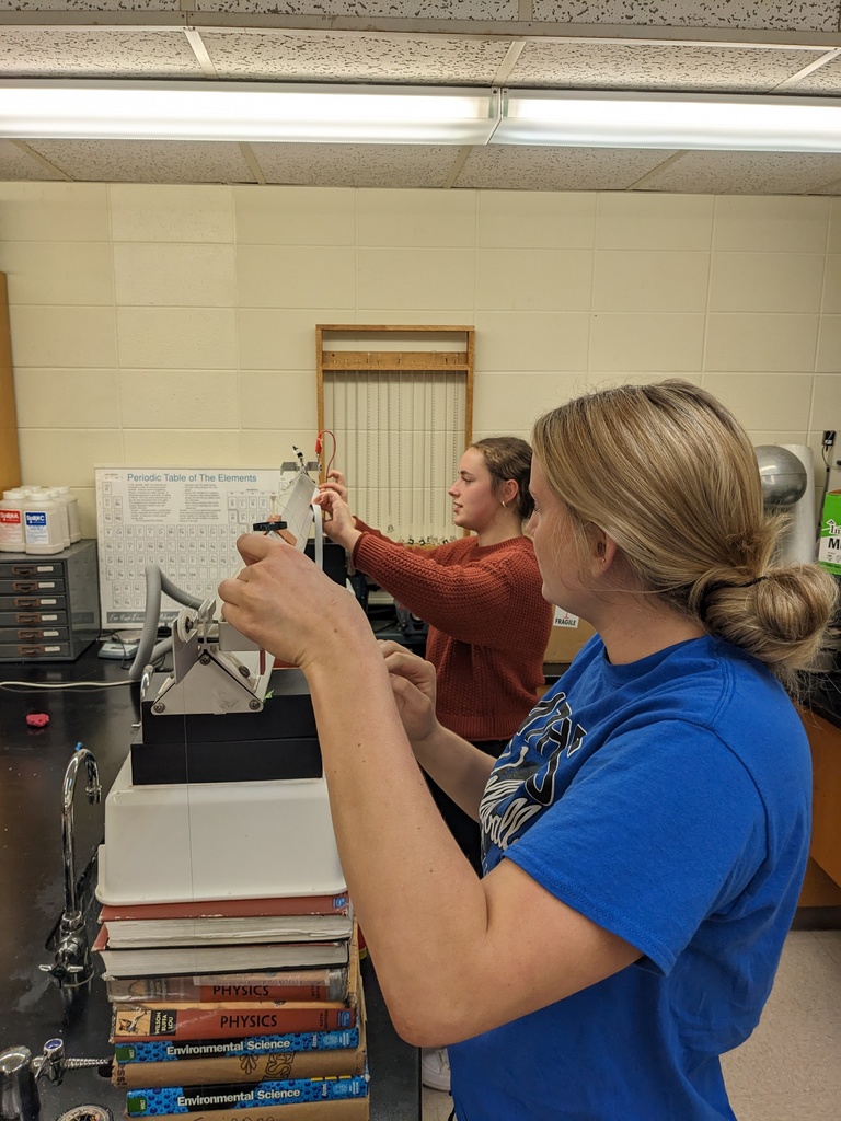 Alexa and Sydney set up the air track.