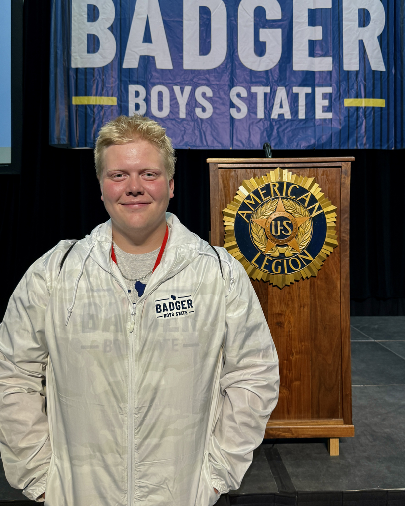 Boy standing in front of podium