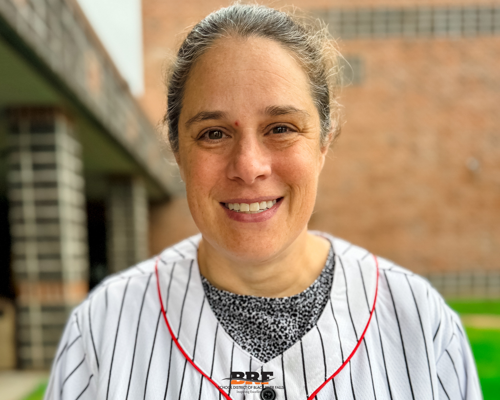 Woman smiling at camera.
