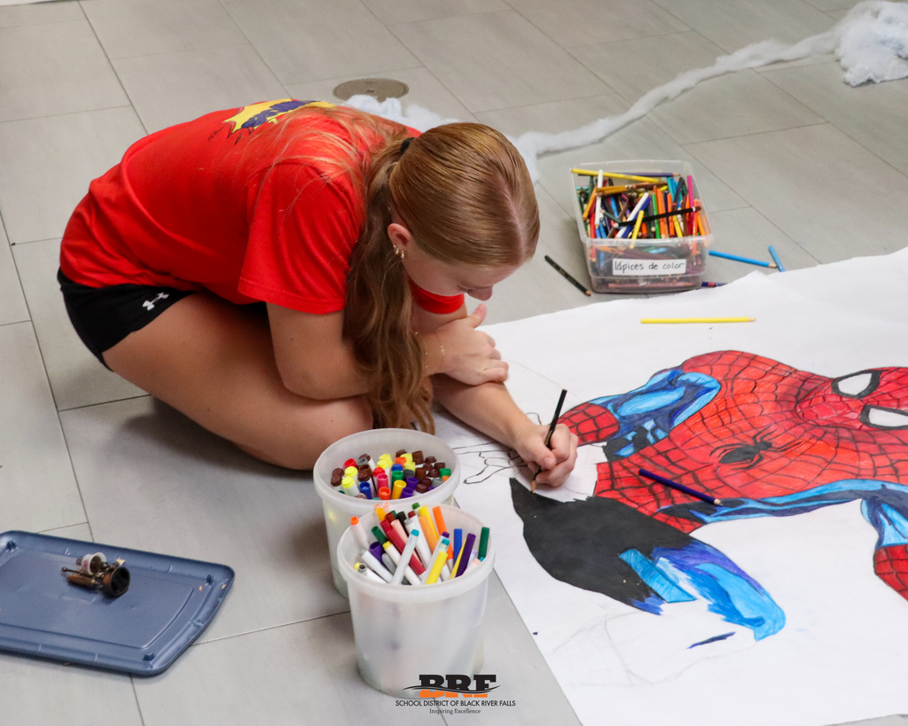 Girl painting a poster