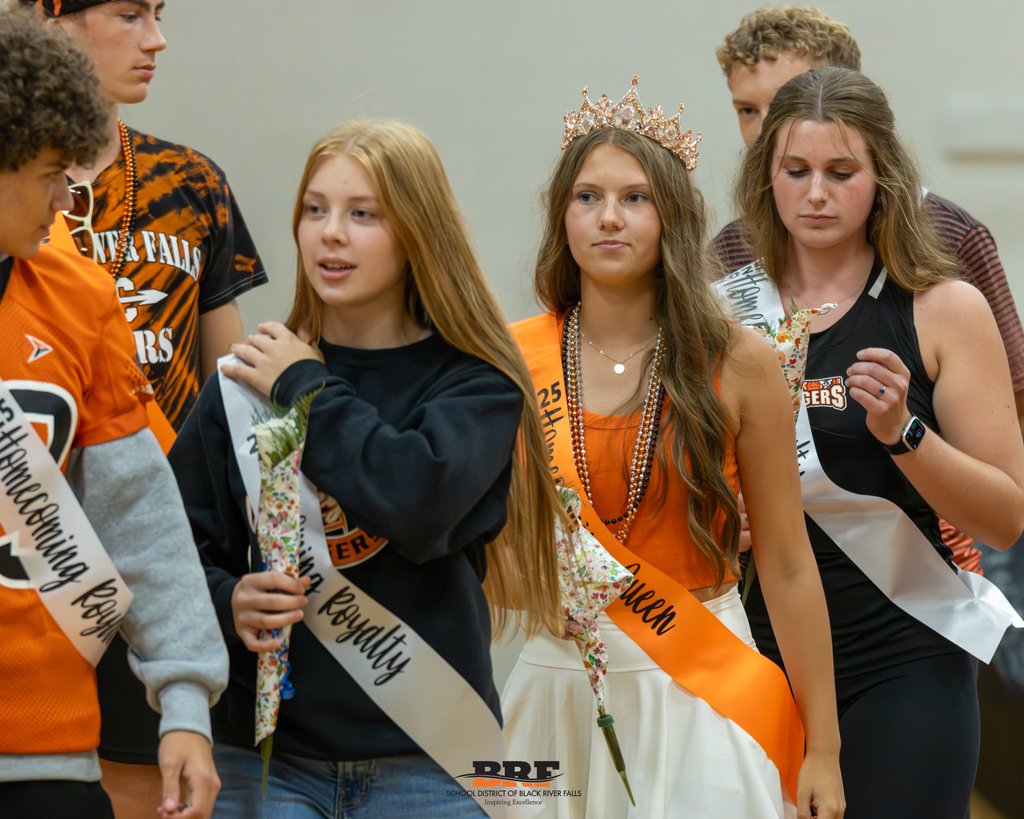 Homecoming court files out of the gym