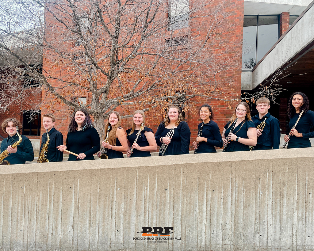High school musicians holding instruments