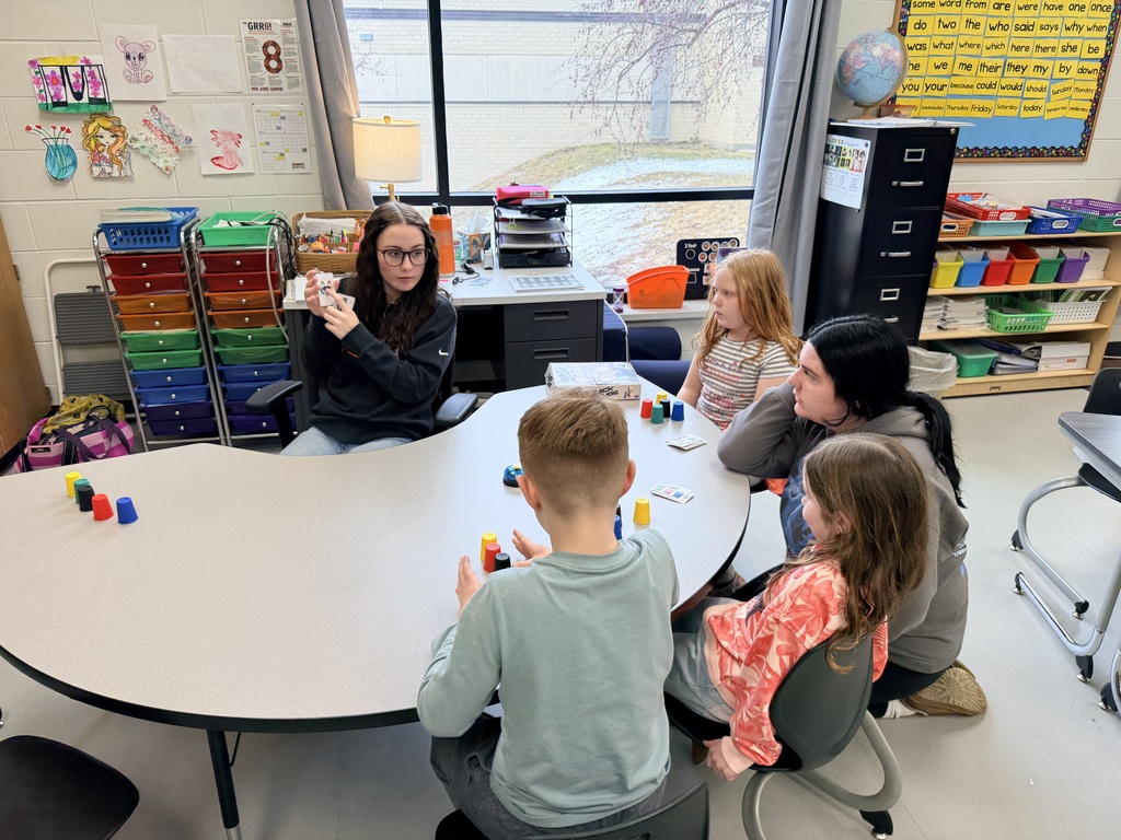 Children sitting around table.