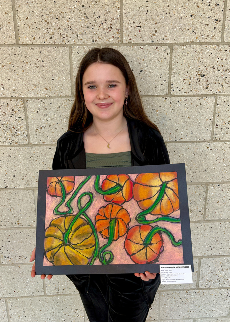 Girl smiling with drawing