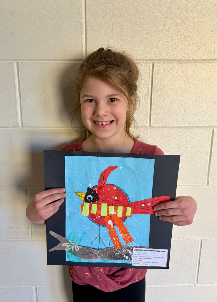 Girl smiling with art project