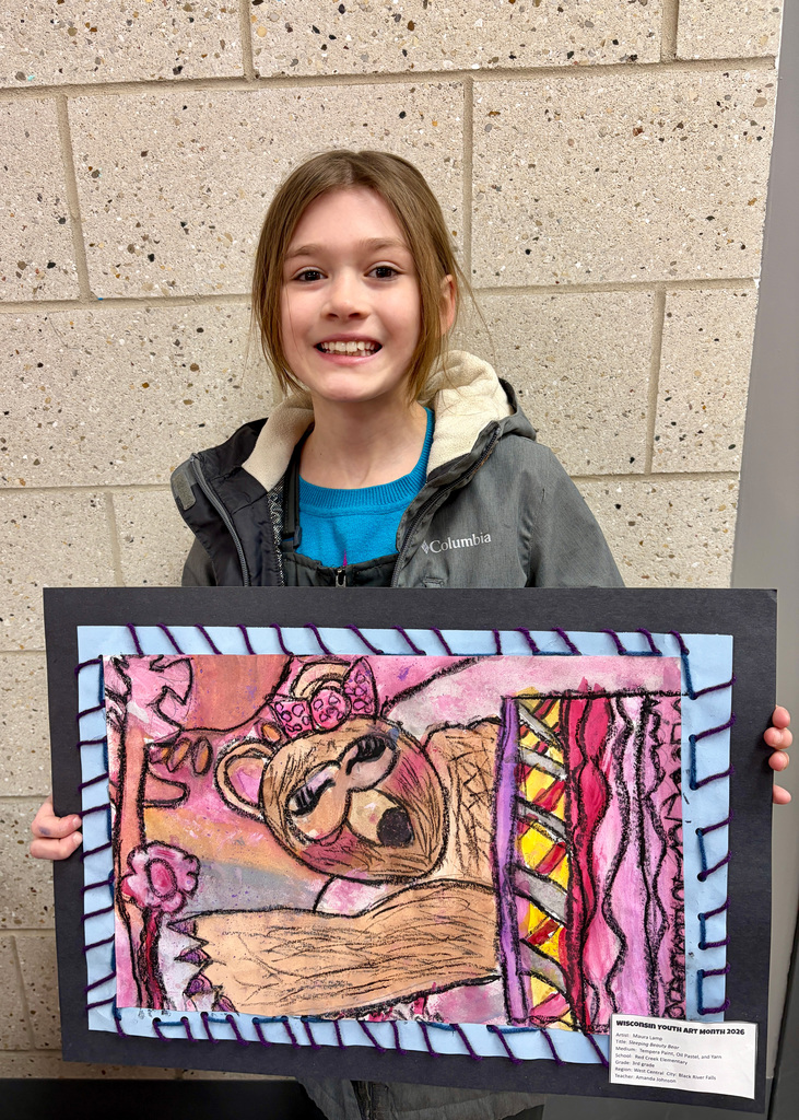 Girl smiling with drawing