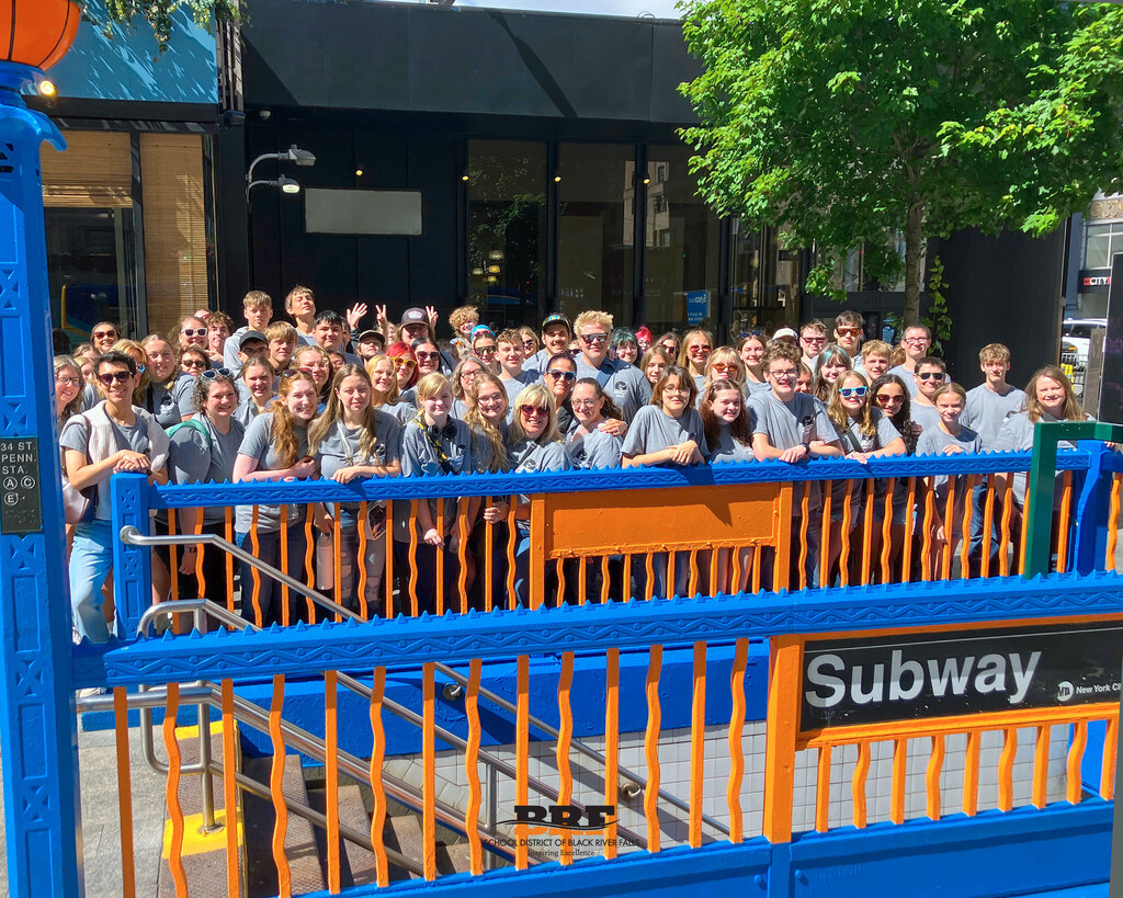 Group of students at Penn Station subway entrance