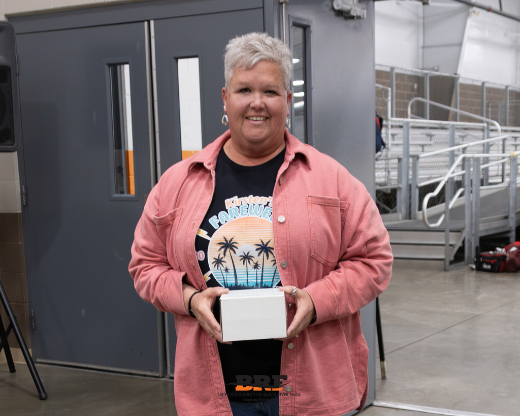 Woman holding a box.