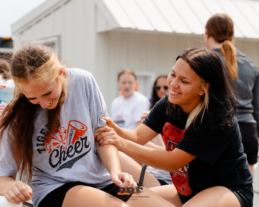 Girls laugh with each other