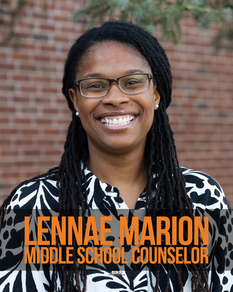 Lennae Marion, Middle School Counselor. Portrait of a woman in a black and white shirt.