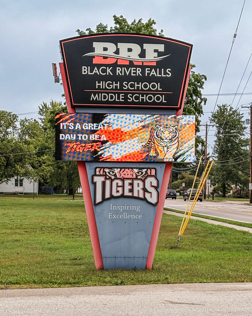 Electronic that says "BRF Black River Falls High School Middle school" It's a great day to be a tiger. Tiger logo with Inspiring Excellence Tagline