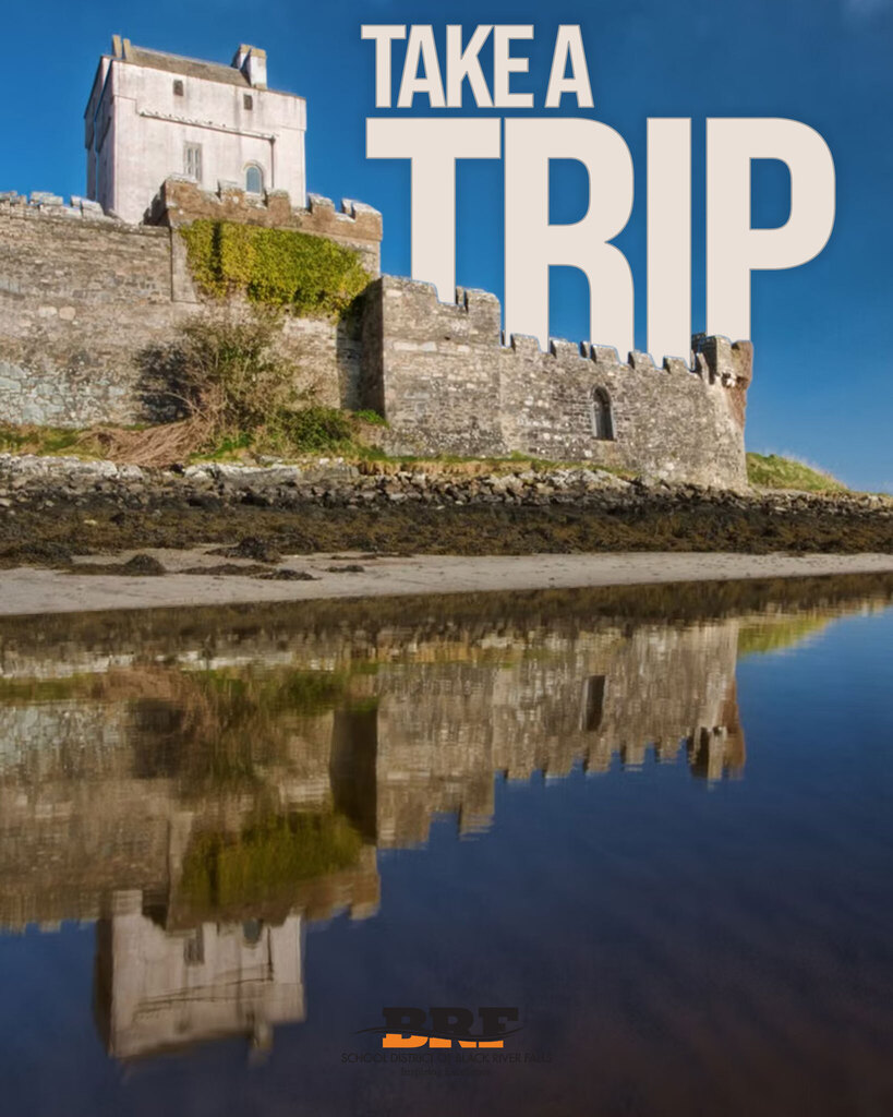 Photo of a castle on a waterfront. Text on image says "Take a Trip."