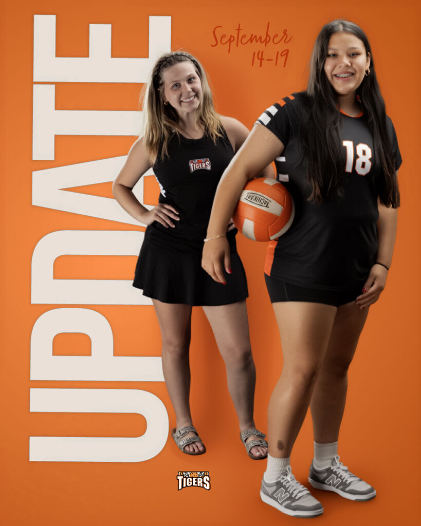 Two girls standing in front of the word "Update." One is wearing a volleyball uniform and has a ball under her arm. The other is wearing a tennis uniform and has her hands on her hips.