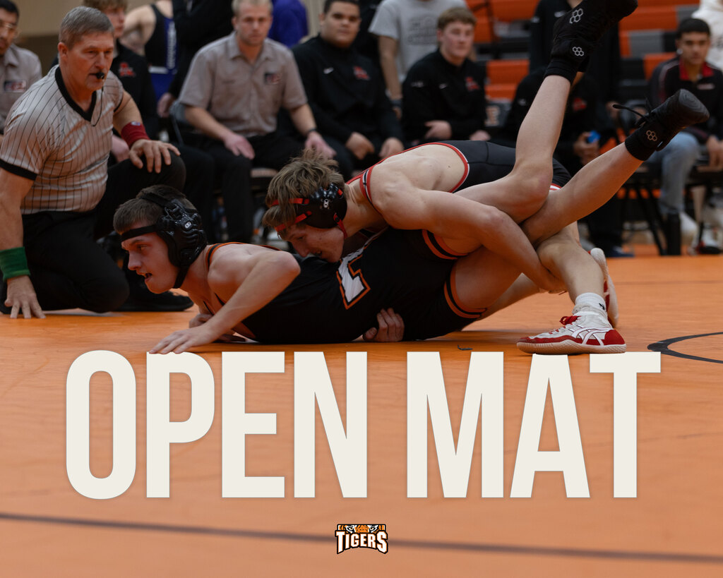 Two people wrestling competitively. Text on image says "Open Mat"