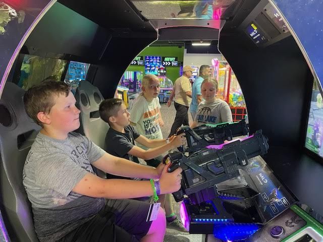 students playing at arcade