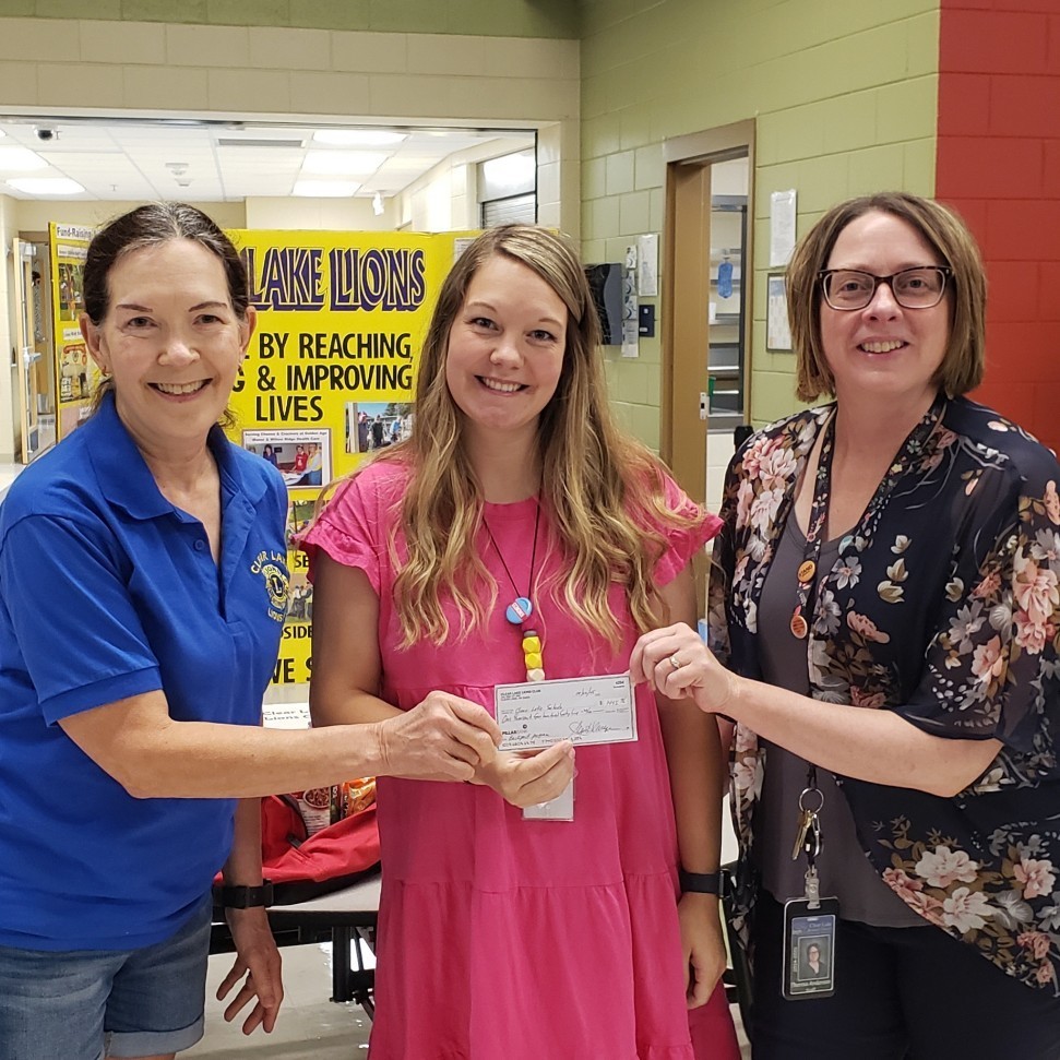 staff receiving a donation check 