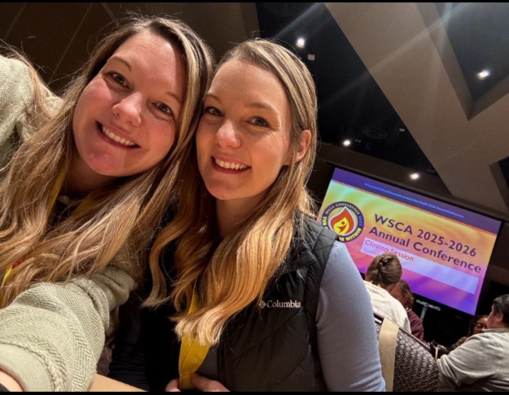 Two female counselors sitting at a table