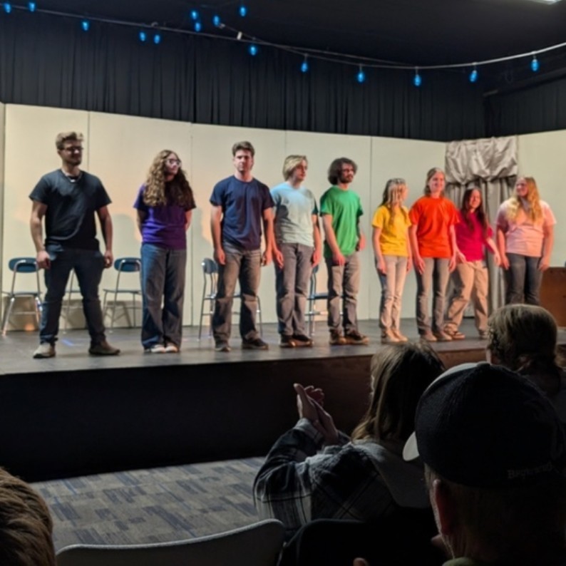 students standing on stage