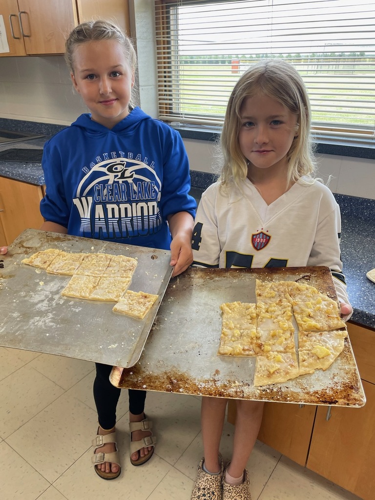 Ally and Avery with dessert pizzas, cinnamon and apple from Cactus Bread.