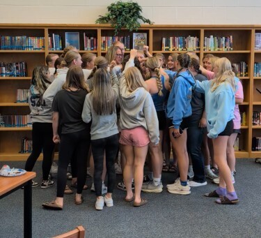Huddle of female athletes