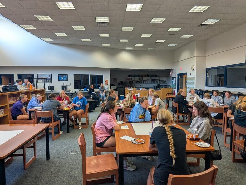 students seated at tables